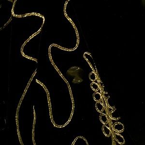 Black fine velvet 4 button double breasted Jacket. Decorated with gold soutache.